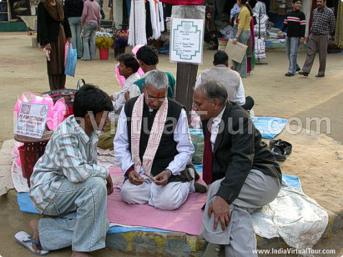 Visitors asking their future from astrologer