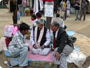 Visitors asking their future from astrologer