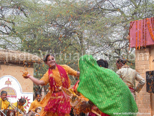 Artists from Uttar Pradesh playing holi with flowers