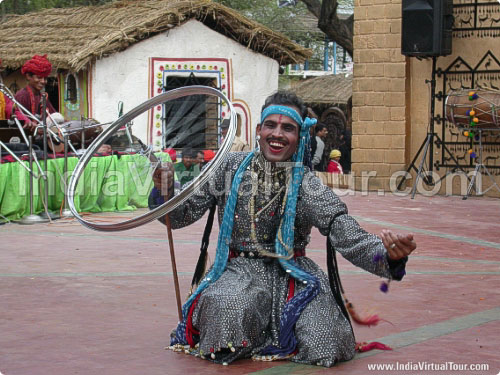 Artist from Rajasthan balancing wheel