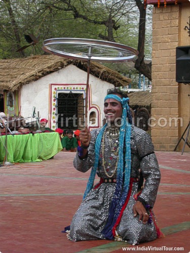 Artist from Rajasthan balancing wheel