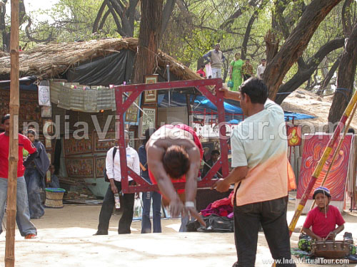 Tamasha by an artist, passing through a rectangle of knifes