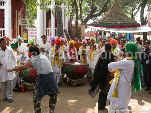 Visitors having fun with artists from Haryana State