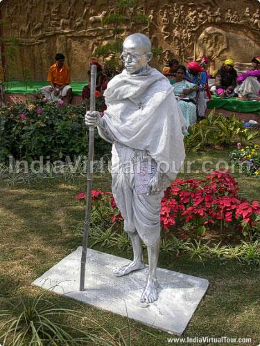 An artist posing as statue of Mahatma Gandhi, father of nation