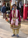 Artist posing as lord Krishna hanging out in fair ground