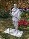 An artist posing as statue of Mahatma Gandhi, father of nation